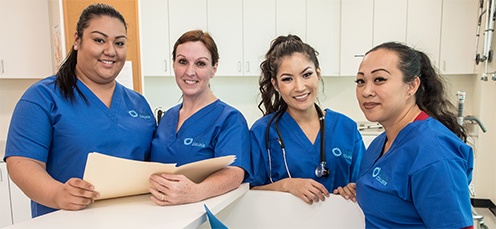 Team of medical professionals gather together