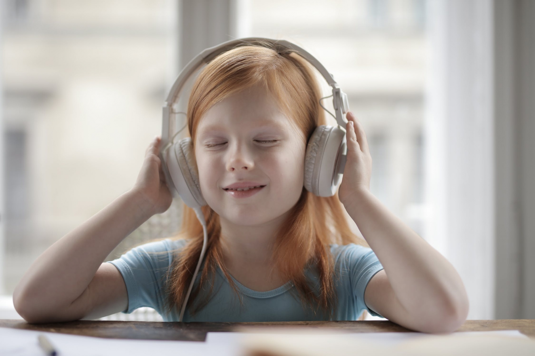 Young girl using headphones