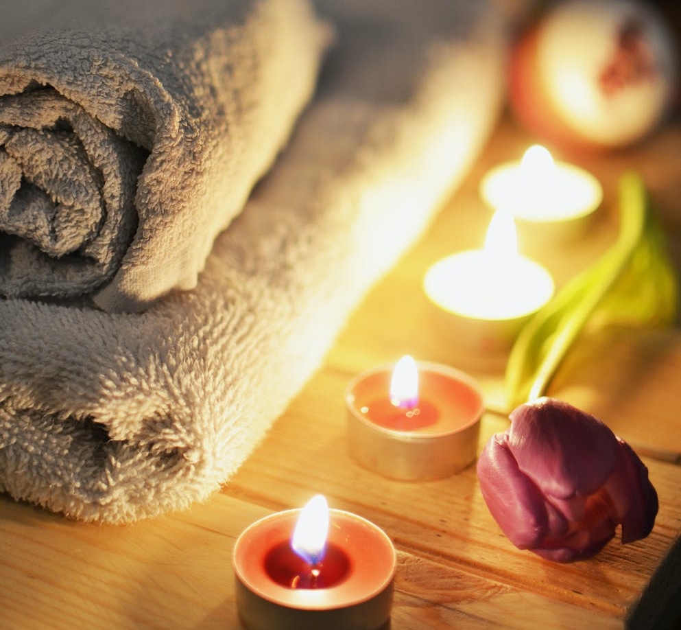 Towels and lit candles