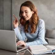 Smiling woman using a laptop
