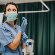 Masked nurse in an emergency room