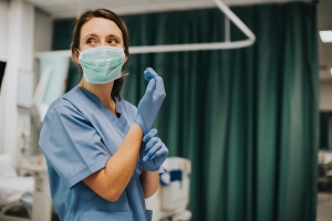 Masked nurse in an emergency room
