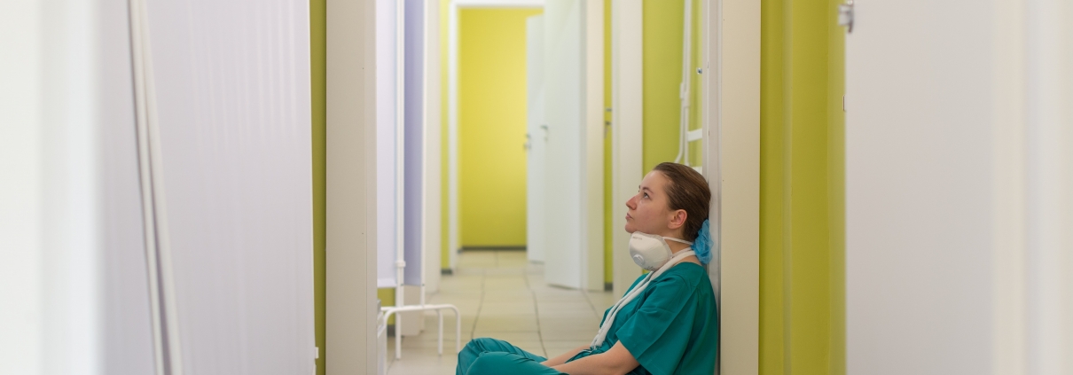 Nurse sitting in a hallway