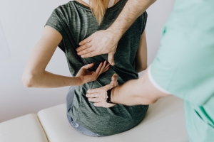 Healthcare professional assisting a patient