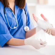 Nurse changing a patient's bandages