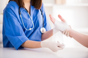 Nurse changing a patient's bandages