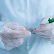Close up of a catheter in gloved hands