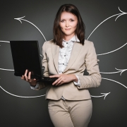 Female professional holding a laptop