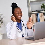African-American nurse using a headset