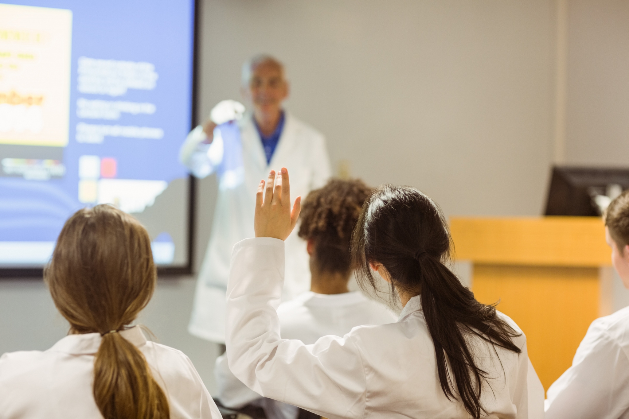 Medical professional teaching a class