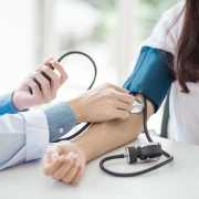 Medical professional taking vital signs