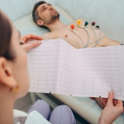 Medical professional administering EKG test