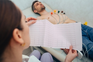 Medical professional administering EKG test
