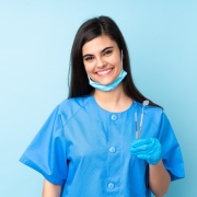 Young professional holding dental tools