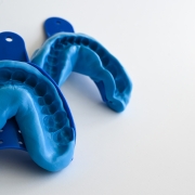 Blue dental impressions of teeth and gums