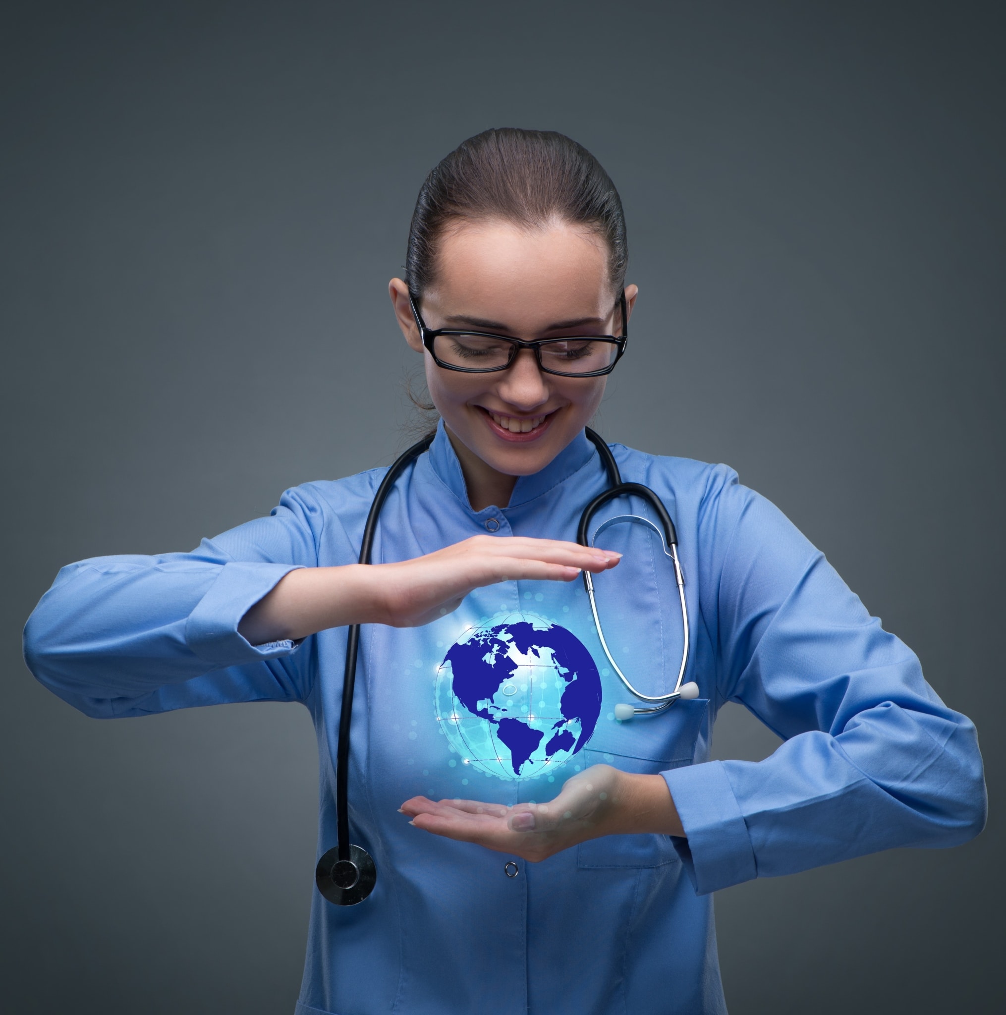 Nurse holding a virtual globe in her hands