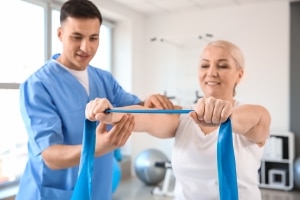 Physical Therapist Assistant with a patient