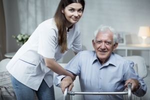 Female caretaker with elderly man