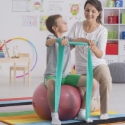 Physical Therapist Assistant with pediatric patient