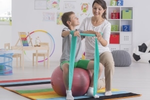Physical Therapist Assistant with pediatric patient