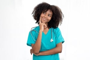 African-American nurse in a contemplative pose