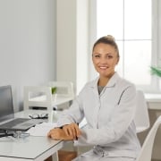 Female nurse administrator sitting at a desk