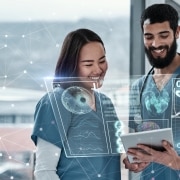 Medical team using a tablet and AI to view 3D holographic patient information